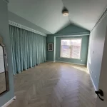 wooden flooring and blue room