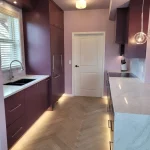 purple kitchen area with sink