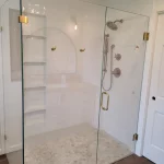 new shower area in white bathroom remodel