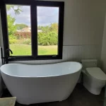 tub and toilet in bathroom remodel