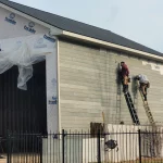 Construction of a outdoor building two men